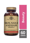Solgar Skin, Nails and Hair Formula -pullo, 60 tablettia; ruskea lasipullo kultaisella metallikorkilla, mattabeige etiketti musta-kultaisella serifitekstillä, vieressä pinkki "Beauty"-kortti valkoisella tekstillä
