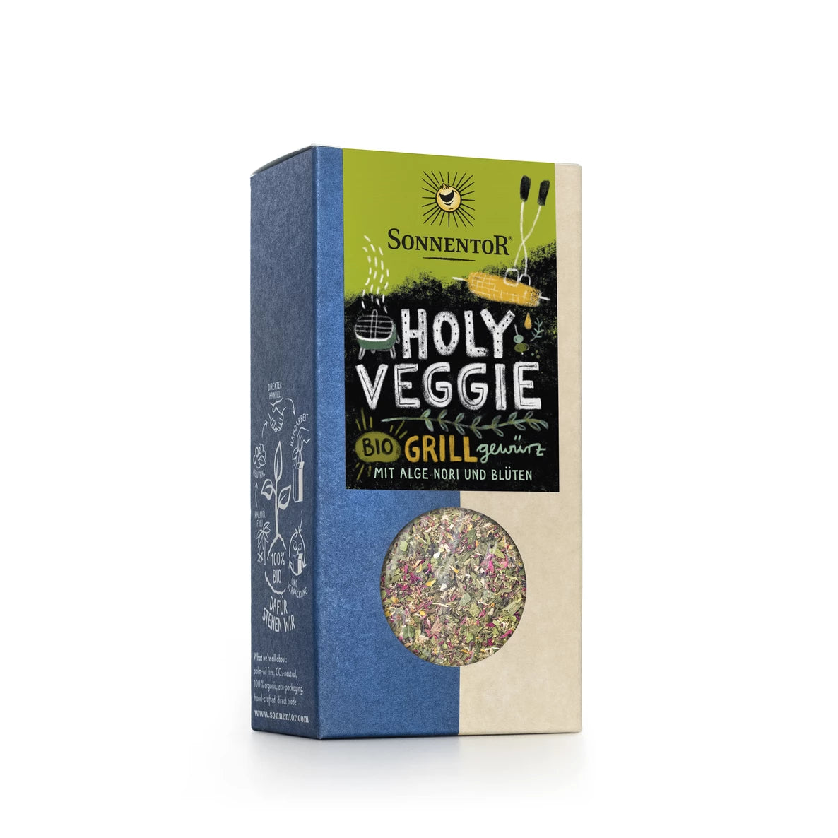 Suorakulmainen laatikko merkinnällä Sonnentor Holy Veggie Bio Grill on valmistettu mattapintaisesta pahvista pääosin kermanvärisin ja sinisin sävyin. Etiketissä on painettuja yrtti- ja kukkakuvituksia sekä pieni kirkas ikkuna näyttämässä sekoitetut mausteet sisällä. Antiikva- ja isokirjaimista typografiaa käytetään. Tausta on valkoinen, eikä kuvassa näy ihmisiä tai käsiä.