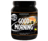Supermass Nutrition Good Morning -herätysjuomajauhe, maku Apple-Lemon; musta lieriömäinen muovipurkki mattapinnalla, kierrekansi; etiketissä kaupunkisiluetti, auringonnousu ja vihreä omenakuvake, valkoista ja vihreää tekstiä; kuvattu tasaisesti valaistulla vaalealla taustalla.