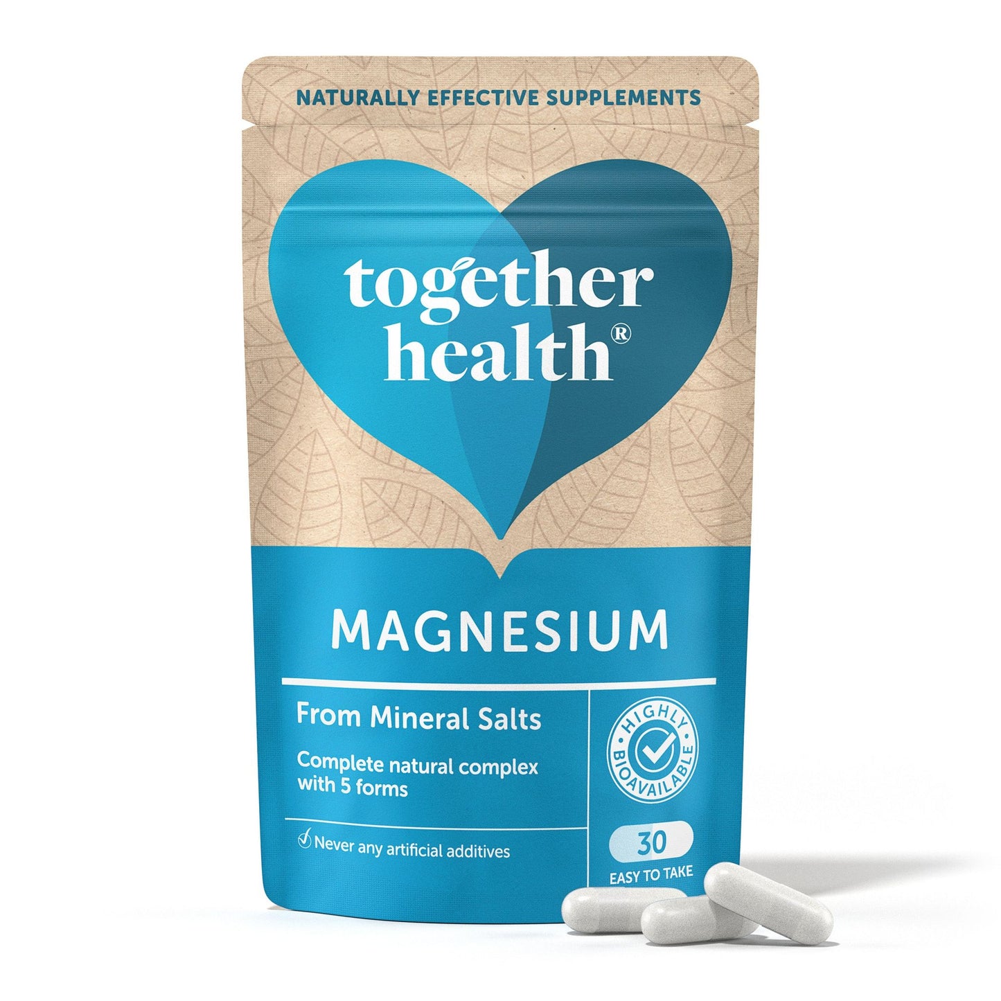 A blue and beige pouch of Together Health Magnesium supplements stands upright, labeled From Mineral Salts. Matte finish and flexible rectangular pouch with resealable top; front label uses mixed sans-serif fonts in white, light blue, and navy. Three off-white capsules rest on a plain white surface directly in front of the packaging. No people or hands are visible.