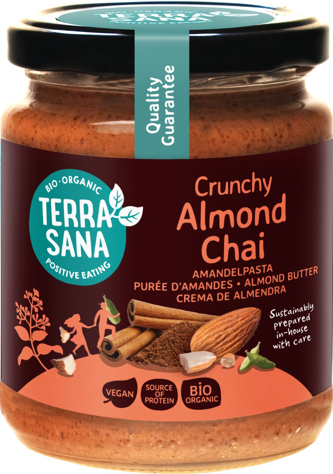 TerraSana Crunchy Almond Chai -luomumantelitahna lasipurkissa, etiketissä kaneli, kardemumma ja mantelit