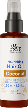 Urtekram Kookos Hiusöljy, pullo ravitsevalle Nordic Beauty -hiusöljylle kookospähkinä-versiona, 100 ml; pullo sylinterimäinen pumppuannostelijalla ja läpinäkyvä runko, jossa näkyy vaaleankeltaista öljyä; etiketti mattapintainen, beige tummalla groteskitekstillä; luettavassa etiketissä maininnat luomusertifikaatista, vegaanisuudesta, 100-prosenttisesta luonnollisesta alkuperästä ja kookosöljystä; ei ihmisiä eikä käsiä näkyvissä, tausta valkoinen, tuote keskitetty kuvaan.