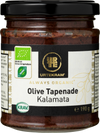 Urtekram Luomu Tapenade Kalamata Oliivi, lasipurkki luomu-kalamataoliivitapenadelle, 190 g, mustalla metallikannella ja mattapintaisella etiketillä; etiketti pääosin valkoinen ja vihreä, luettavassa tekstissä tuotenimi, luomu- ja KRAV-sertifikaattilogot sekä kuvitettu oliivinoksa; groteskitypografia käytössä; tausta valkoinen, ei ihmisiä eikä käsiä näkyvissä.