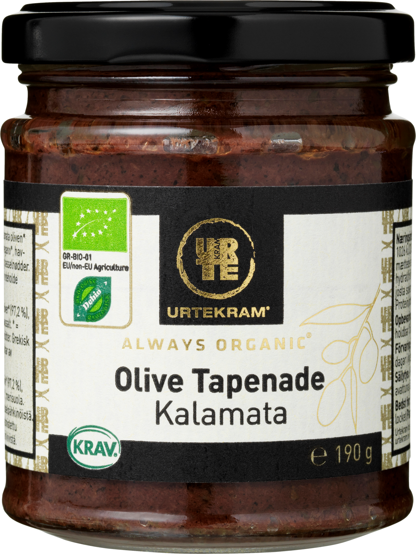 Urtekram Luomu Tapenade Kalamata Oliivi, lasipurkki luomu-kalamataoliivitapenadelle, 190 g, mustalla metallikannella ja mattapintaisella etiketillä; etiketti pääosin valkoinen ja vihreä, luettavassa tekstissä tuotenimi, luomu- ja KRAV-sertifikaattilogot sekä kuvitettu oliivinoksa; groteskitypografia käytössä; tausta valkoinen, ei ihmisiä eikä käsiä näkyvissä.