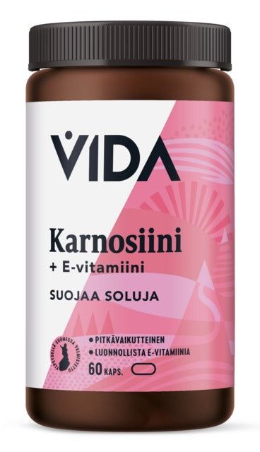 Vida Karnosiini 400 mg; ruskea pullo tekstillä "VIDA Karnosiini + E-vitamiini" -ravintolisää, vaaleanpunainen ja valkoinen ulkoasu, teksti kertoo solujen suojaamisesta; muovipullo lieriömäinen mattapinnalla, etiketissä groteskifontti; "60 kaps." näkyvissä lähellä alaosaa; tausta valkoinen; ei ihmisiä tai käsiä kuvassa.