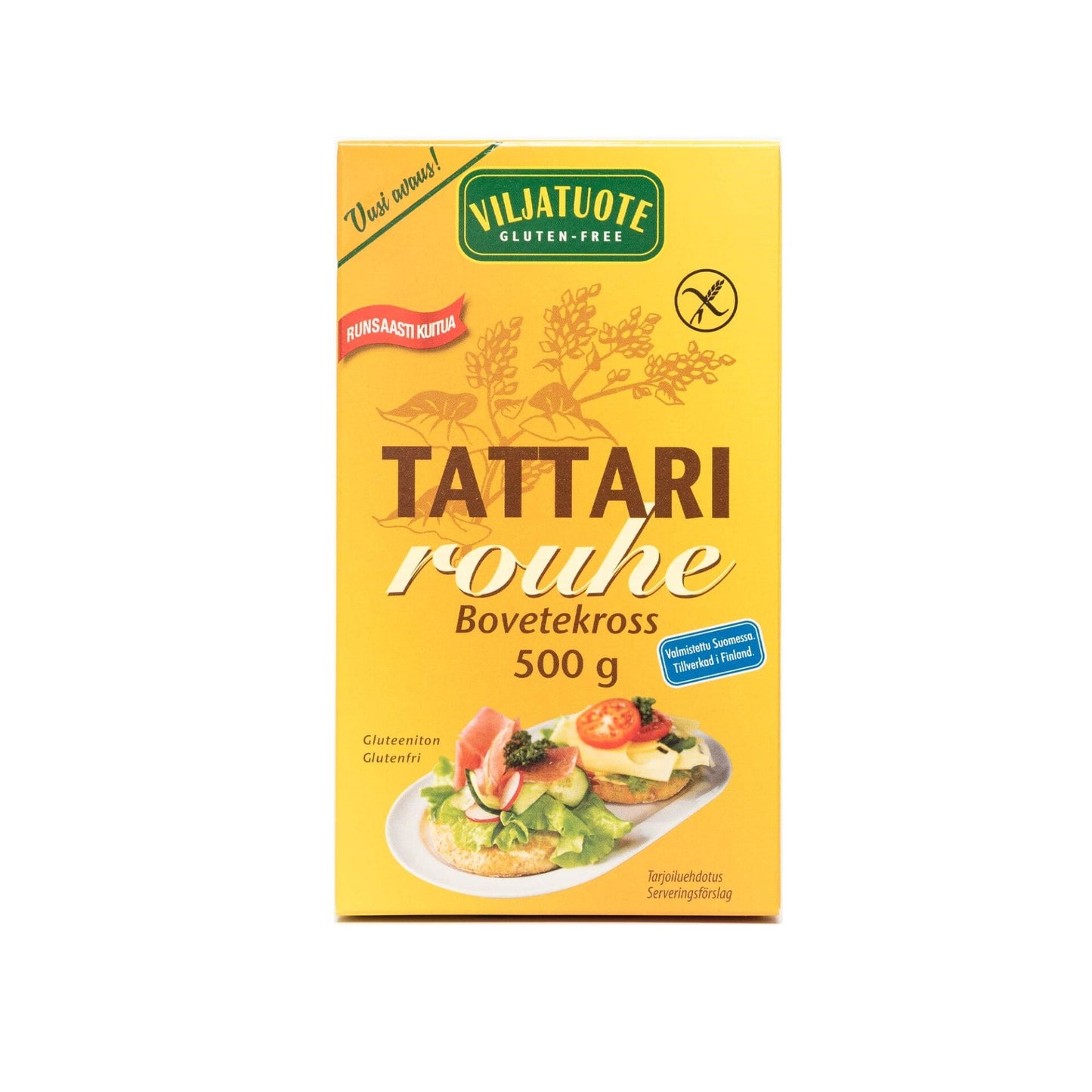 Keltainen Viljatuote Tattari rouhe -laatikko, suomalainen gluteeniton tattarituote, 500 g; pahvipakkaus mattapinnalla ja suorakaiteen muotoinen; etiketissä lihavoitua groteskikirjasinta valkoisena ja ruskeana; laatikon etusivulla kuvia leivänpaloista erilaisin täyttein keltaista taustaa vasten; ei ihmisiä tai käsiä näkyvissä; tausta yksinkertainen ja neutraali studiotausta.