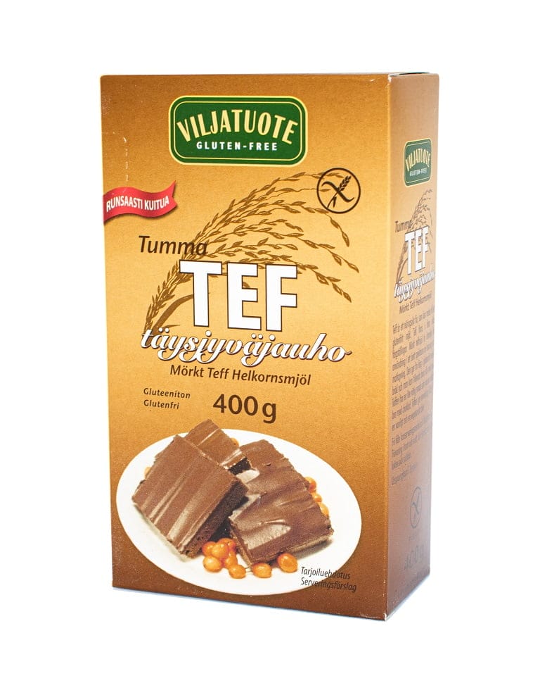 Virtasalmen Viljatuote Gluteeniton Tumma Teff Täysjyväjauho, 400 g; ruskea-kultainen laatikko mattapinnalla, kannessa kuva suklaakuorrutteisista herkuista ja teff-jyvistä; groteski- ja lihavoitua typografiaa; ei ihmisiä tai käsiä näkyvissä; tuote kuvattu kokonaan edestäpäin neutraalilla taustalla.