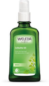 Weleda Cellulite Oil -pullo, vihreä, valkoinen pumppukorkki, mattapinta, koivunlehtikuvitus etiketissä; teksti tuotteen toiminnasta