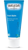 Weleda Foot Balm -tuubi, sininen, valkoinen korkki, mattapinta, sylinterinmuotoinen; valkoinen kasvikuvitus, lihavoitu groteskiteksti "Refreshes and cares for tired feet"