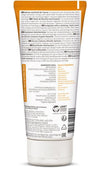 Back of a Weleda shower cream tube with text in German and English, listing ingredients, product information, certifications, and usage instructions; the packaging is white with orange accents and highlights natural ingredients. Plastic tube has a matte finish and a curved shape. Typography on the label is sans-serif. Background is plain white. Shot shows only the product with no people or hands present.