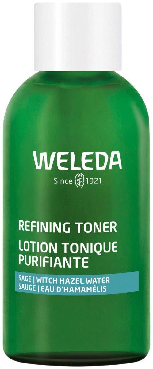 Weleda Refining Toner; vihreä pullo kasvovettä salviaa ja taikinapensasvettä sisältäen; läpinäkymätön sylinterinmuotoinen lasipullo kiiltäväpinnalla, valkoinen kierrekorkki; etiketissä yksinkertaista valkoista groteskitekstiä englanniksi ja ranskaksi; yksivärinen tausta, ei ihmisiä tai käsiä; tuote kuvan keskellä, kirkastaa ja tasoittaa ihon pintaa.