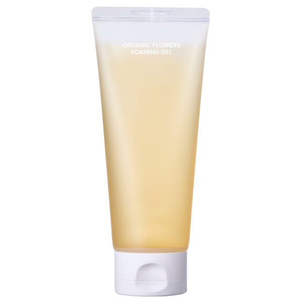 Whamisa Organic Flowers Foaming Gel; läpikuultava keltainen muovituubi valkoisella läppäkorkilla seisoo pystyssä; pinta sileä ja puolikiiltävä; etiketissä teksti ”Organic Flowers Foaming Gel” groteskifontilla, alla pieniä kasviaiheisia kuvia; ei ihmisiä tai rekvisiittaa näkyvissä; tausta yksivärinen valkoinen, kuvattu tasaisessa valaistuksessa edestä.