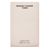 Whamisa Organic Flowers Toner Deep Rich; beige suorakaiteen muotoinen rasia tekstillä ”ORGANIC FLOWERS TONER”, merkinnät ”Organic 97%” ja ”200ml / 6.7 fl.oz.” siistillä groteskifontilla etusivulla; oikeassa reunassa hienovarainen pistekuvio; pakkaus mattapintainen; ei ihmisiä tai käsiä, tuote kuvattu tasaisella taustalla.