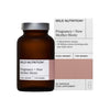 A brown supplement bottle labeled Pregnancy + New Mother Biotic stands beside its box, both branded with Wild Nutrition and For Women. Both the bottle and box have a matte finish. The rectangular box displays legible text including 30 capsules, 4 microbe strains, and 30 billion CFU. Typography is sans-serif, mainly black on a white background with some gray accents. No people or hands are present; plain light background; straight-on product shot.