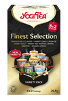 YogiTea Luomu Finest Selection Tee; makuvalikoimapakkaus, kuvitettuja teekuppeja ja tekstiä, joka listaa makuja kuten makea chai, vihreä tee ja inkivääri-sitruuna; yrttiteepakkaus sisältää 8 lajitelmaa, 2 pussia kutakin, yhteensä 29,8 g; laatikko on suorakulmainen mattapinnalla ja monivärisillä kuvituksilla; etiketissä serif-kirjasin brändäyksessä ja tiedoissa; ei ihmisiä tai käsiä, neutraali tausta, tuote kokonaan näkyvissä.