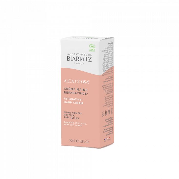 Alga Cicosa Reparative Hand Cream Korjaava Käsivoide; rasia Laboratoires de Biarritz Alga Cicosa -korjaavaa käsivoidetta, 50 ml, valkoinen ja persikanvärinen ulkoasu mattapinnalla; suorakulmainen pahvipakkaus minimalistista groteskitypografiaa; sekä ranskan- että englanninkielistä tekstiä näkyvissä; ei ihmisiä tai käsiä; neutraali tausta, tuote keskitettynä kuvaan.