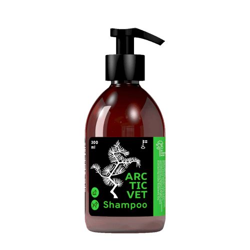 A 300ml brown bottle with a plastic pump dispenser is centered against a plain white background. The bottle has a black, matte-finish label with bold sans-serif text reading “Arctic Vet Shampoo.” A white pine tree graphic, small green accent elements, and three icons for pet use are included on the label. No other objects or people are shown in the image.
