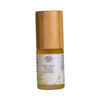 A small bottle of Saaremaa Taika Bakuchiol Booster face oil with a wooden cap and a minimalist label, featuring bakuchiol, stands upright on a white background. The bottle is cylindrical and transparent with clear liquid inside. The cap is smooth, light-colored wood. Label is matte, white, features simple black sans-serif text. No people or hands present in the image. The shot uses even overhead lighting for soft shadows.