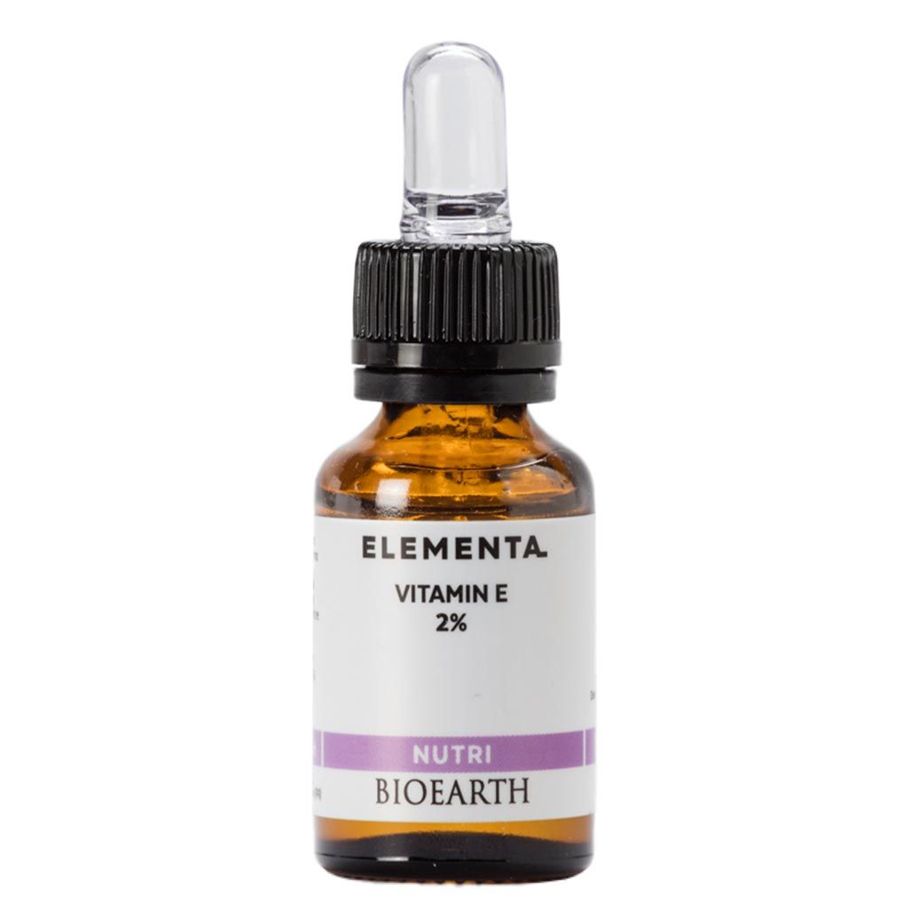 A small amber glass dropper bottle labeled Elementa Vitamin E 2% Nutri Bioearth with a black cap and clear dropper, designed for precise application of nourishing skincare. Bottle is cylindrical with a glossy finish. Label text uses sans-serif font in black. The background is plain white, and the image shows only the product with no people or hands visible.