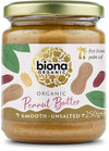 Biona Organic Peanut Butter, tasainen ja suolaton, 250 g; lieriömäinen lasipurkki leveällä kultaisella metallikannella ja mattapintaisella etiketillä; etiketti tumma, väritetyin maapähkinä- ja lehtikuvituksin; pääteksti lihavoitu, valkoinen groteski; mainitaan palmuöljyttömyys ja luomu; neutraali tausta, ei ihmisiä tai käsiä; suoraan edestä kuvattu tuotekuva.