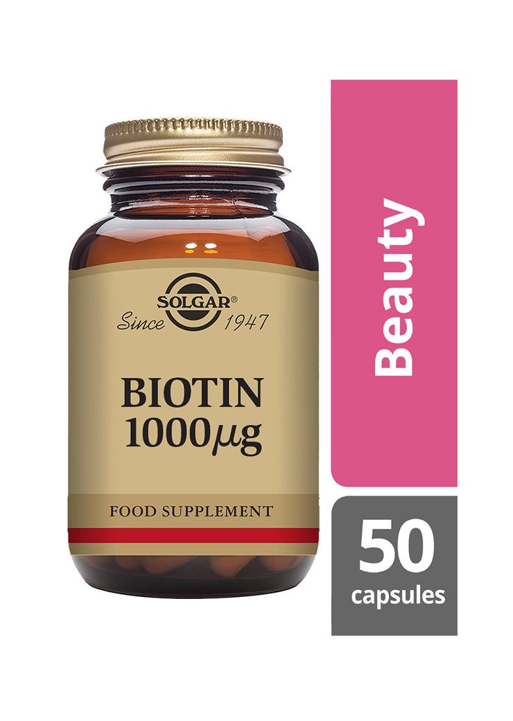Solgar Biotiini 1000 mikrog -pullo, ruskea lasi, beige-kultainen etiketti; vaaleanpunainen "Beauty"-nauha, hiusten ja ihon terveyden tueksi, lihavoitu musta-kultainen antiikvateksti, 50 kapselia