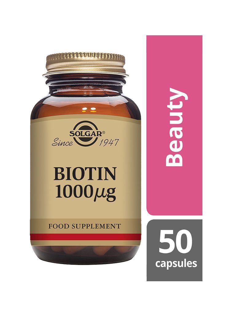 Solgar Biotiini 1000 mikrog -pullo, ruskea lasi, beige-kultainen etiketti; vaaleanpunainen "Beauty"-nauha, hiusten ja ihon terveyden tueksi, lihavoitu musta-kultainen antiikvateksti, 50 kapselia