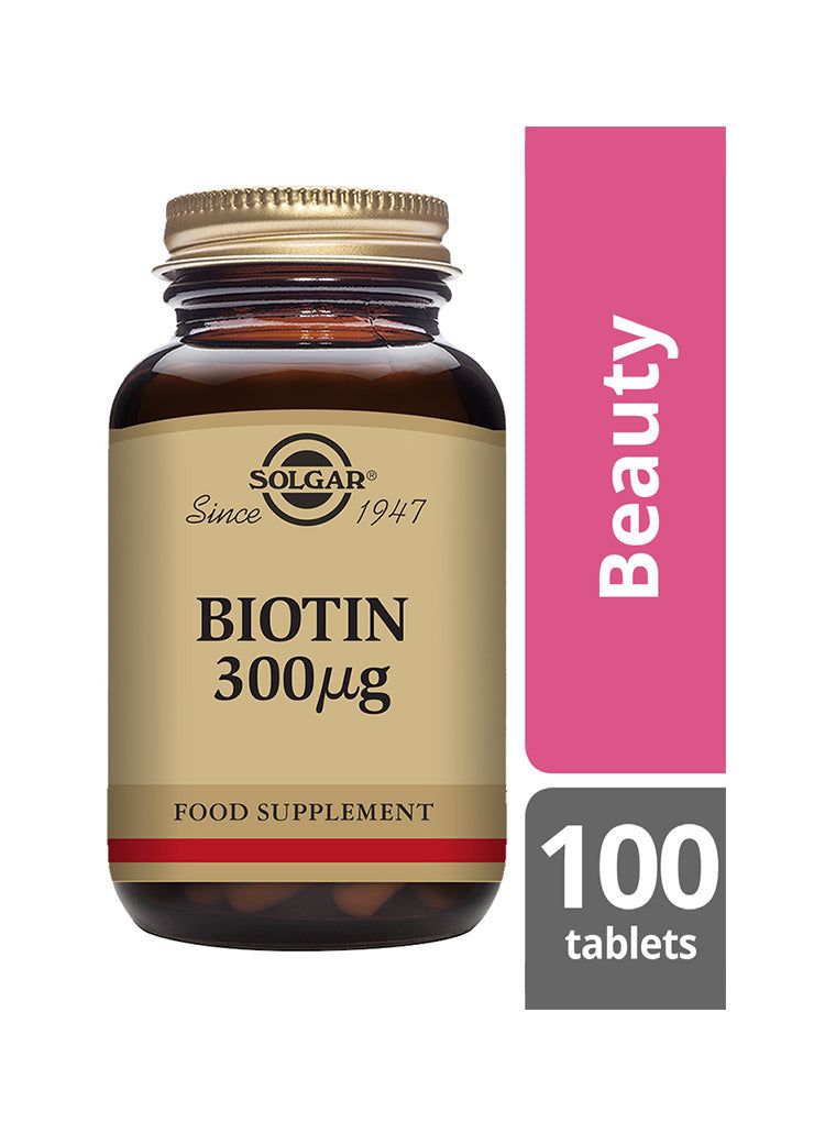 Solgar Biotiini 300 mikrog -pullo, meripihkanvärinen lasi, matta kultainen kierrekorkki; beige etiketti lihavoidulla mustalla tekstillä, vaaleanpunainen "Beauty"-laatikko, 100 tablettia