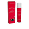 A red box and a matching bottle of Detria Arbutin 24h Brightening Face Cream, both with white labels featuring sans-serif typography. The bottle has a pump dispenser and both items are positioned upright. They are surrounded by various colorful berries and a small Finnish flag. The background is plain white. No people or hands are visible in the shot.