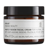 A brown glass jar with a black lid labeled Evolve Organic Beauty Nightly Renew Facial Cream for normal/dry skin, featuring bidens pilosa and peony extract, 60ml, formulated with 99.9% natural origin ingredients for radiant, healthy skin. The label uses simple black sans-serif text on a white background. The container is cylindrical and has a matte finish. No people or hands are visible. The product is photographed against a plain light-colored background in a centered shot.