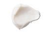 A dollop of smooth, white moisturizing cream is spread in a swirl pattern on a plain white background. No packaging or label is visible. The finish of the cream surface appears glossy. There are no people, hands, or other objects shown in the shot.