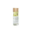 A clear cylindrical plastic bottle of Feel Free Instant Duo Makeup Remover with a matte-finish wooden screw cap. Label features green illustrated leaf designs and sans-serif printed text, including product name and mention of waterproof makeup removal for sensitive skin. The background is plain, white, and uncluttered. Bottle sits upright with no people or hands visible in the shot.