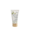 A white tube of Feel Free Moisturizing Day Cream with a cylindrical wooden cap and a matte surface finish. The front displays green leaf graphics and printed text listing ingredients including pomegranate oil, avocado oil, and aloe vera. The product name is in sans-serif font. Neutral background with no visible people or hands. A white tube of Feel Free Moisturizing Day Cream with a wooden cap, featuring green leaf artwork and text highlighting ingredients such as pomegranate oil, avocado oil, and soothing