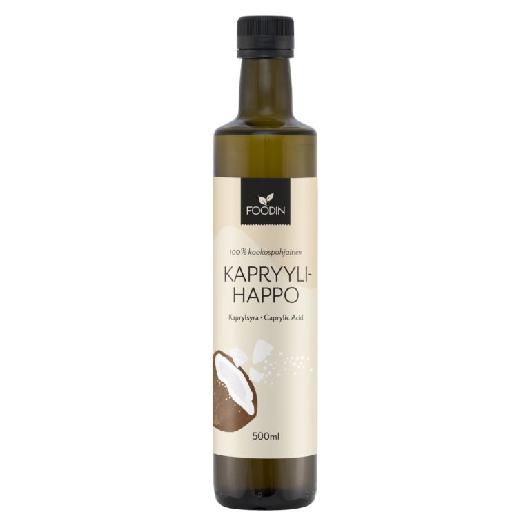 Foodin Kapryylihappo -pullo, 500 ml; sylinterimäinen, tummasta materiaalista valmistettu ja mattapintainen pullo mustalla kierrekorkilla; etiketissä teksti "KAPRYYLIAHAPPO" suuraakkosin lihavoituna sekä realistinen kookospähkinäkuvitus; kuvattu yksiväristä taustaa vasten, ei ihmisiä tai käsiä näkyvissä.