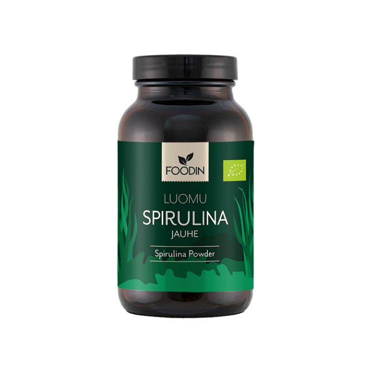 Foodin Luomu Spirulina Jauhe; tumma, lieriömäinen, mattapintainen purkki; etiketissä vihreitä korostuksia ja tyyliteltyjä spirulinalehtikuvia sekä lyhyt tuoteteksti; sisältää puhdasta, luomua spirulinajauhetta; tuote kuvattu edestäpäin vaalealla taustalla, ei ihmisiä.