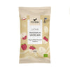 A beige bag of Foodin organic white chocolate raspberry snacks, featuring raspberry and chocolate illustrations, labeled Veg and 50g, with Finnish and EU organic logos. Matte flexible pouch with straight seams; product name in bold sans-serif font; simple graphic icons. Front-facing studio shot on a plain background. No people or objects besides the bag visible in frame.