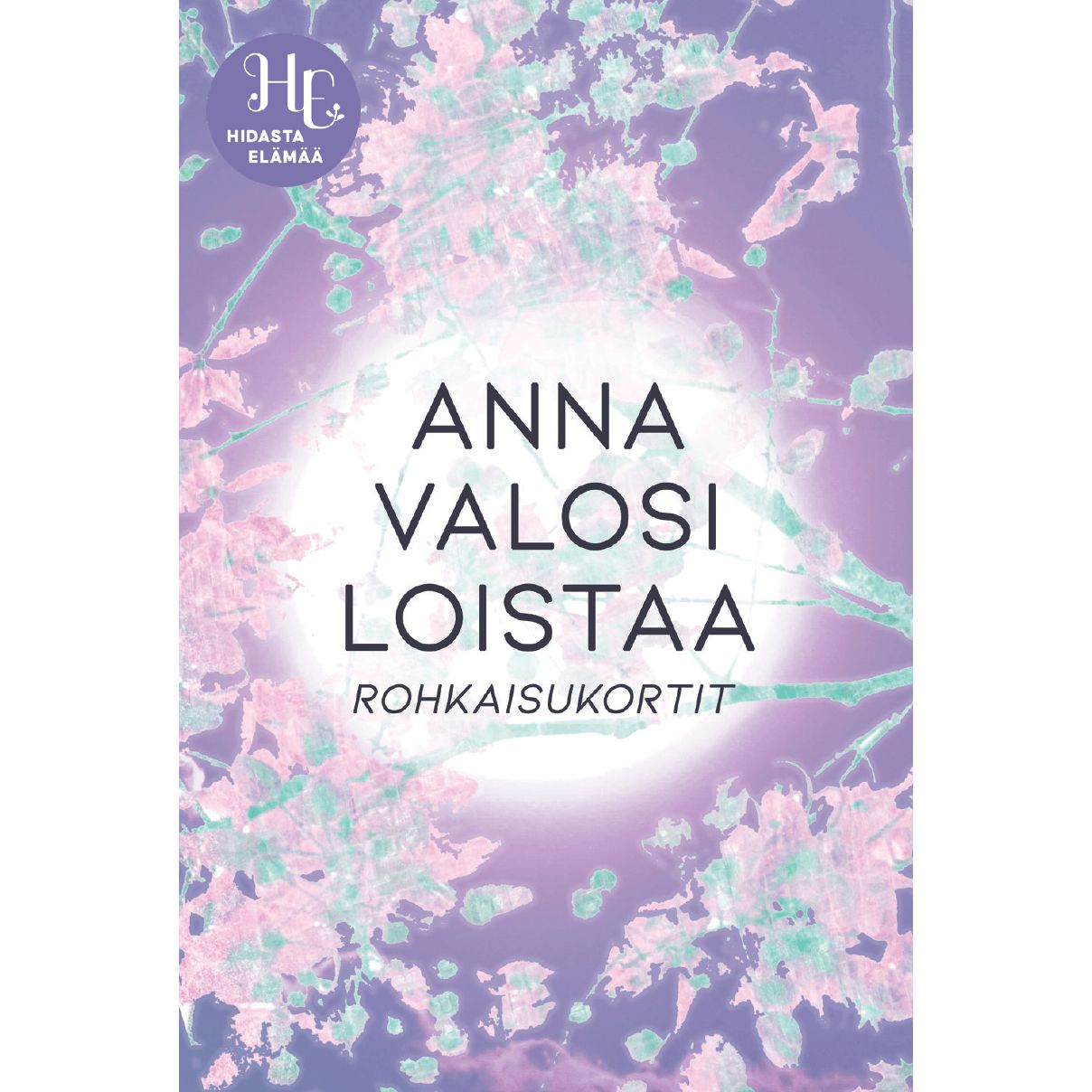 A pastel-toned card displays text: Anna Valosi Loistaa Rohkaisukortit with a glowing light and delicate floral pattern. A logo in the top left says HC Hidasta Elämää. The card is rectangular with rounded corners, appears to have a matte finish, features sans serif text, and is photographed against a neutral background with no people or hands visible.