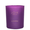 A purple glass candle jar with a matte finish is cylindrical in shape. The front has gold serif text displaying JOIK HOME & SPA and LA BOHÈME. The lid appears to be black and flat. Background is plain white, no people or props are present, and the image is a centered product shot.