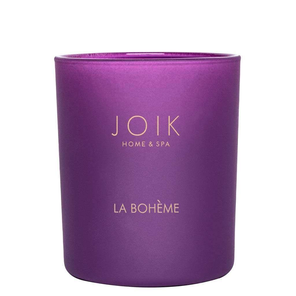 A purple glass candle jar with a matte finish is cylindrical in shape. The front has gold serif text displaying JOIK HOME & SPA and LA BOHÈME. The lid appears to be black and flat. Background is plain white, no people or props are present, and the image is a centered product shot.