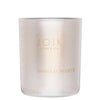 A frosted glass candle with gold text reading JOIK HOME & SPA and VANILLE ET NOISETTE on the front. Cylindrical shape, matte finish. Gold sans-serif typography printed directly on the glass surface. No visible lid or outer packaging. Neutral, seamless background; product is pictured alone in a straightforward studio shot.