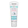 A white tube of Lavera Basis Sensitiv Cleansing Milk with aqua and gray accents, labeled for dry skin, featuring organic aloe vera and shea butter, marked vegan and certified organic. The plastic tube has a matte surface finish with bold sans-serif type in black and blue. Shot on a plain white background. No people or hands visible.