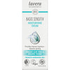 Front of a Lavera Basis Sensitiv Moisturising Cream box, highlighting organic aloe vera and jojoba for normal and combination skin. Features vegan, certified, and carbon neutral logos, emphasizing natural skincare. Rectangular cardboard box with a matte white finish and blue-green accents; product name in bold sans-serif type; icon-style certification logos on the lower section; plain studio background. No people or hands visible.