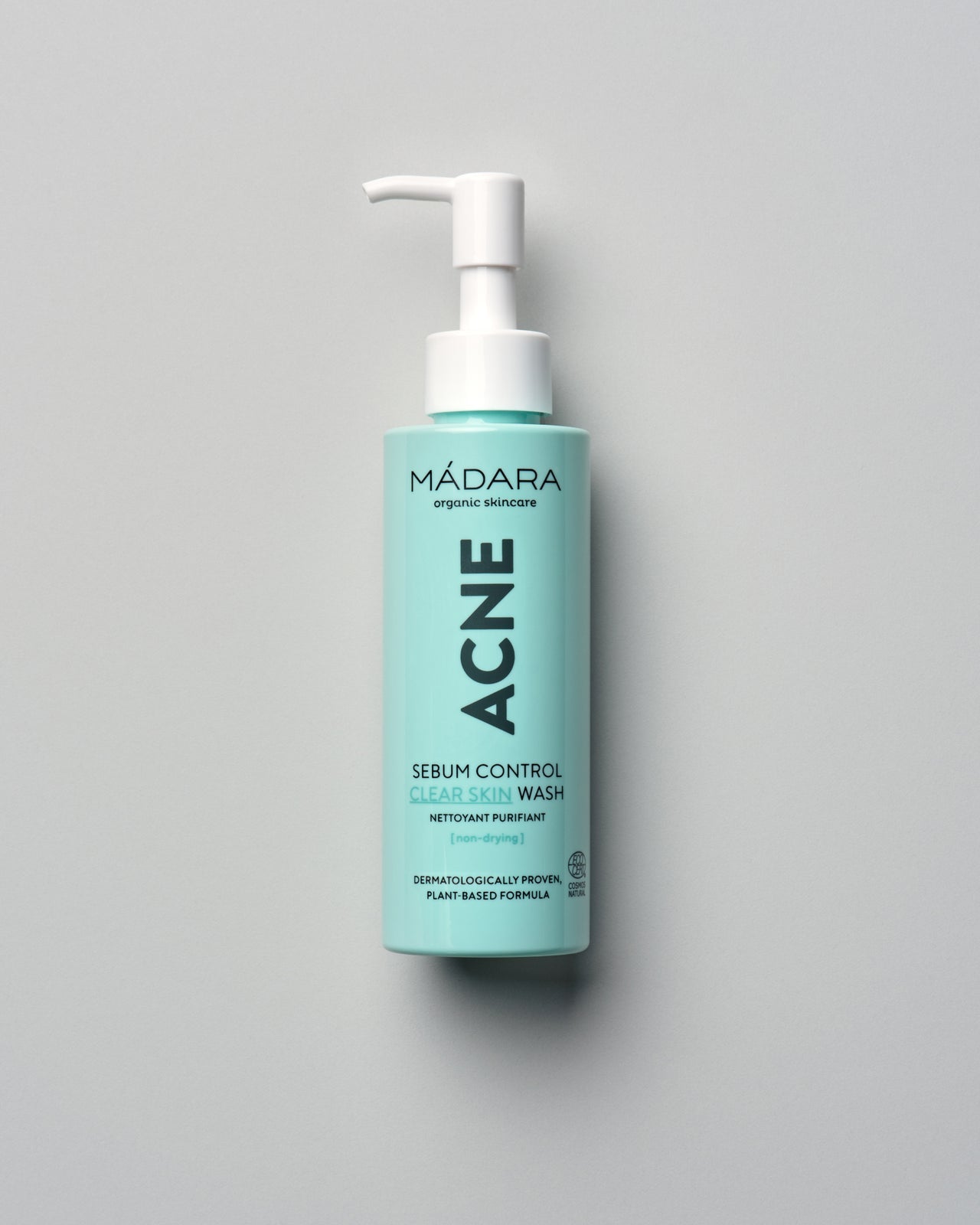 Madara ACNE Clear Skin Puhdistusgeeli; vaaleanturkoosi pumppupullo, vaalea tausta