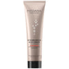 A beige tube of Mádara Intense Repair Body Cream with hyaluronic acid, shea butter, and nourishing alchemilla polyphenols. The plastic tube has a matte finish and a cylindrical shape with a flat flip-top cap. The front label displays bold black sans-serif text and small white star-like illustrations. Product is upright against a plain white background. No people or hands are visible in the image.