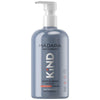 A gray plastic pump bottle with a matte finish, cylindrical shape, and black dispenser. The label displays “MÁDARA KIND gentle wash” in clear sans-serif font, with additional text indicating use for body, hands, bath, and suitability for sensitive skin; includes icons for product certifications and mentions natural ingredients. No people or hands visible. Set against a plain background in a straightforward product shot. A gray pump bottle of MÁDARA organic skincare KIND gentle wash, labeled for sensitive