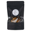 A black, matte-finish, flexible resealable pouch with a rectangular clear window shows dried red chilies. The packaging has a white label with bold and regular mixed-case sans serif text: Kuivattu CHILI Harold St. Barts 10g. No people or actions visible. Product is centrally placed against a plain white background in a straight-on shot.