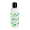 A white bottle with a black cap labeled OLE HYVÄ, decorated with green leaf patterns. The surface appears matte. Legible label text includes Eco & Vegan and 350 ml. All lettering is in clear sans-serif typeface. The bottle is cylindrical and made of plastic. The product stands alone against a plain background in a studio setting, with no people or props visible in the shot.
