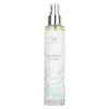 A 100ml spray bottle labeled Merisuola Suihke from the brand Saaren Taika Ecolution, featuring a clear cylindrical plastic body with a white plastic spray nozzle and cap. The label displays soft gray-green grass illustrations in a linear pattern, and legible product name and brand in simple sans-serif font. Background is plain white with no shadows or props. No people or hands are present.