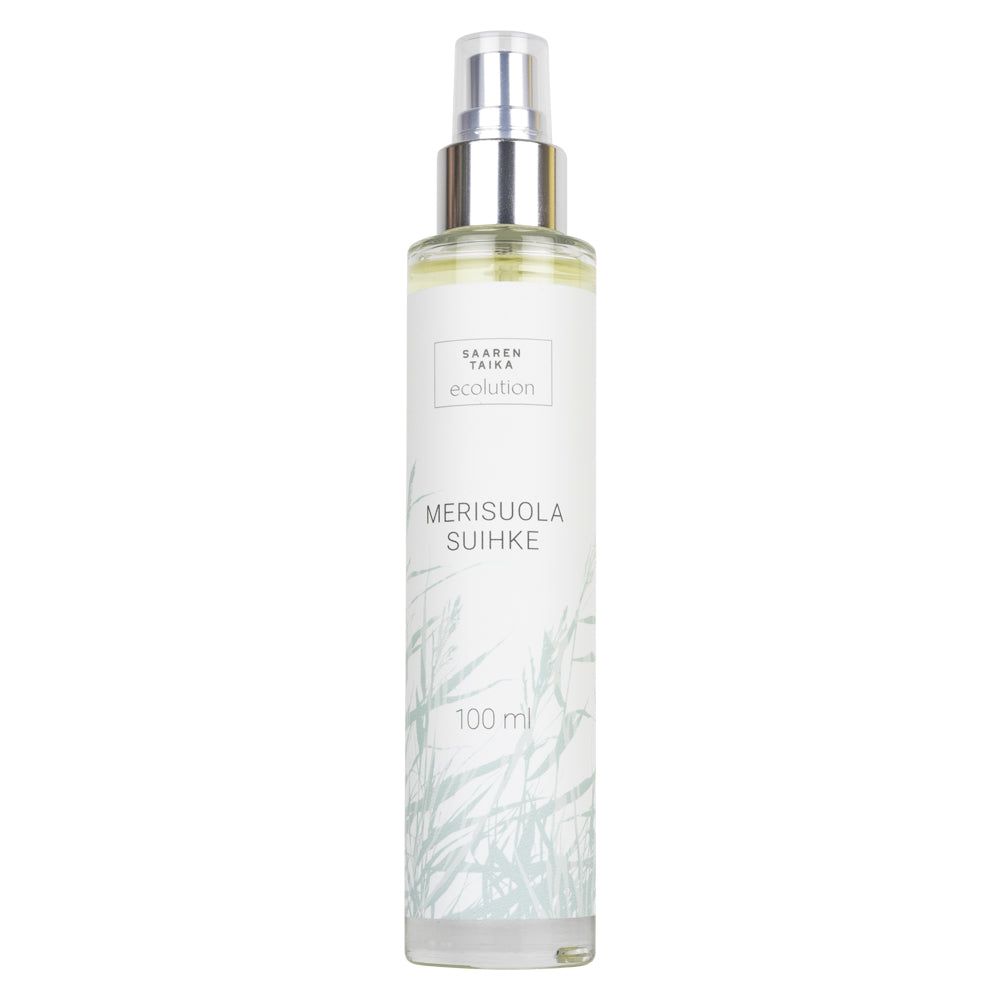 A 100ml spray bottle labeled Merisuola Suihke from the brand Saaren Taika Ecolution, featuring a clear cylindrical plastic body with a white plastic spray nozzle and cap. The label displays soft gray-green grass illustrations in a linear pattern, and legible product name and brand in simple sans-serif font. Background is plain white with no shadows or props. No people or hands are present.