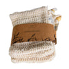 A natural-colored woven soap pouch labeled SAIPPUAPUSSI, featuring a brown paper band with a matte finish and a black illustrated plant design. The band has clear black sans-serif text. The pouch is rectangular with a visible drawstring closure. The product is centered on a plain white background in a front-facing shot. No people or hands present.