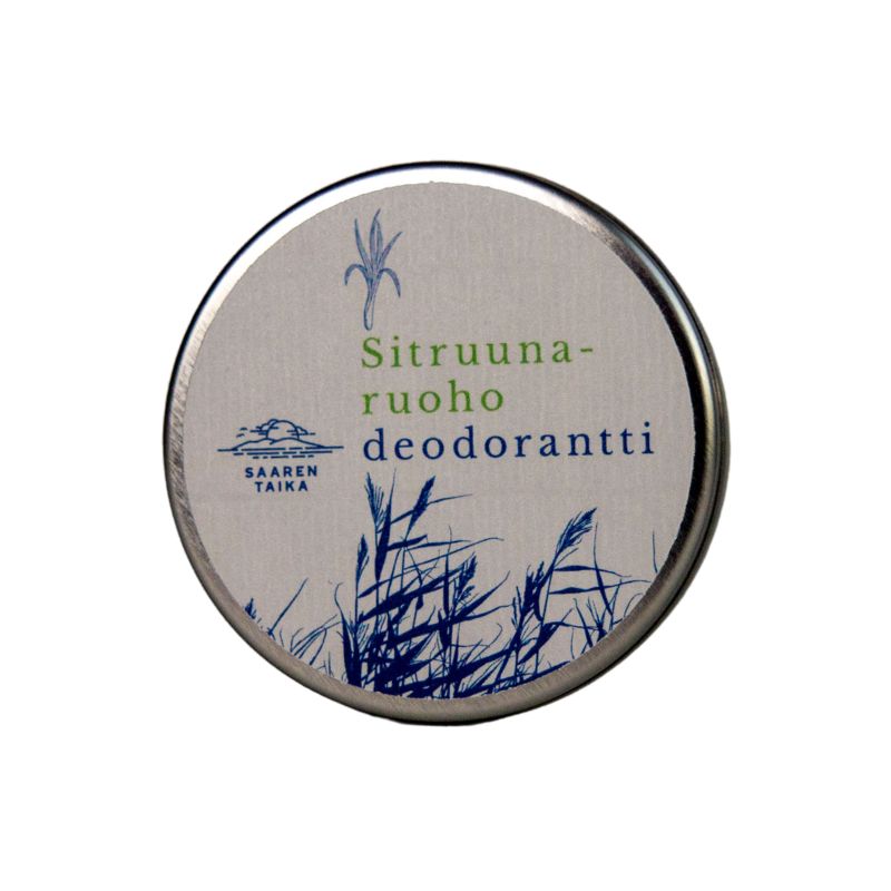 A round metal tin with a matte finish is shown. The packaging is decorated with blue grass-like graphics and includes the text “Sitruunaruohodeodorantti” and a Saaren Taika logo in clear, modern typography. The background is solid white. No people or hands are present. This is a close-up shot of the product container.